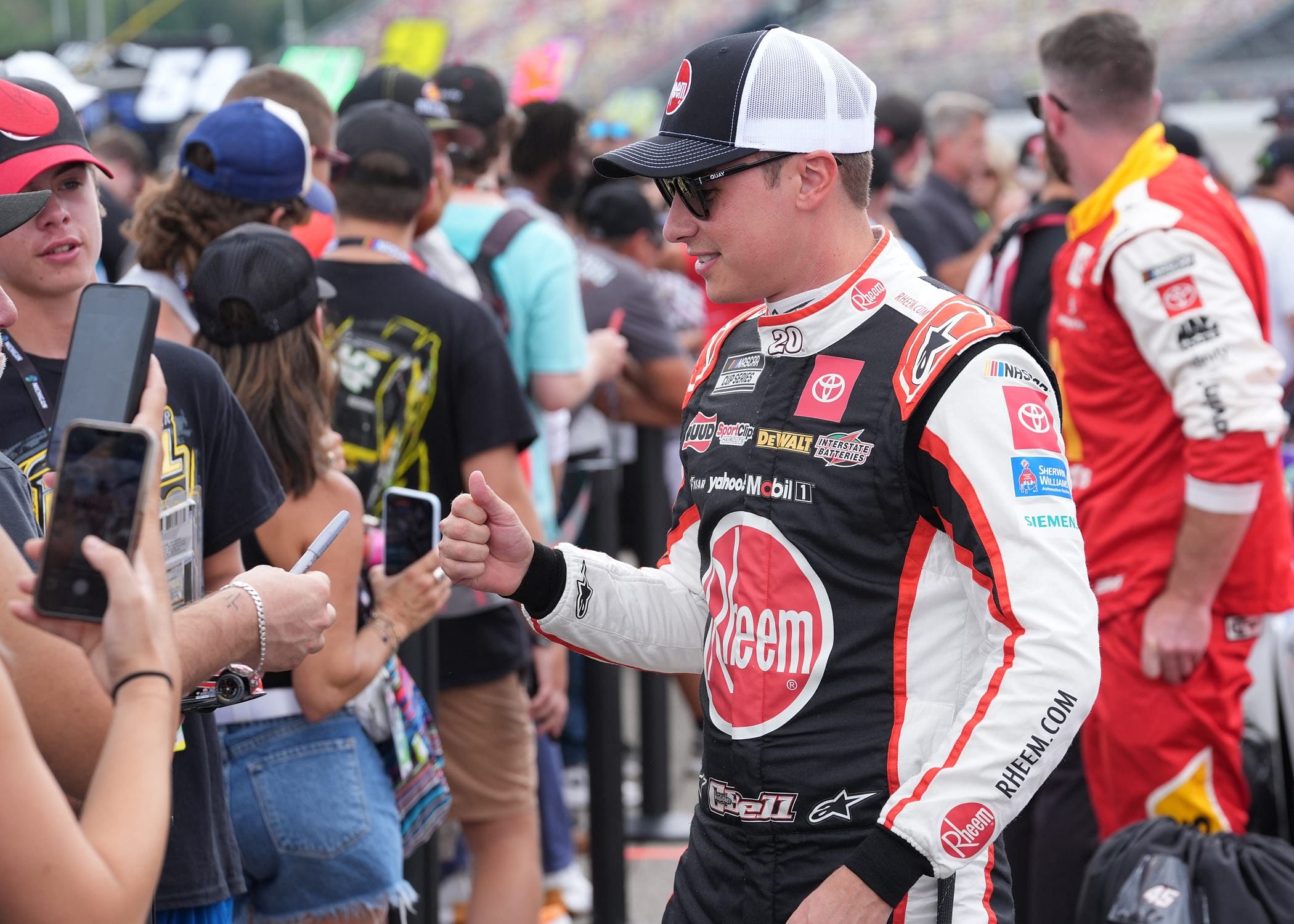 Christopher Bell greets fans before the NASCAR Cup Series FireKeepers Casino 400 at Michigan International Speedway. Source: Imagn